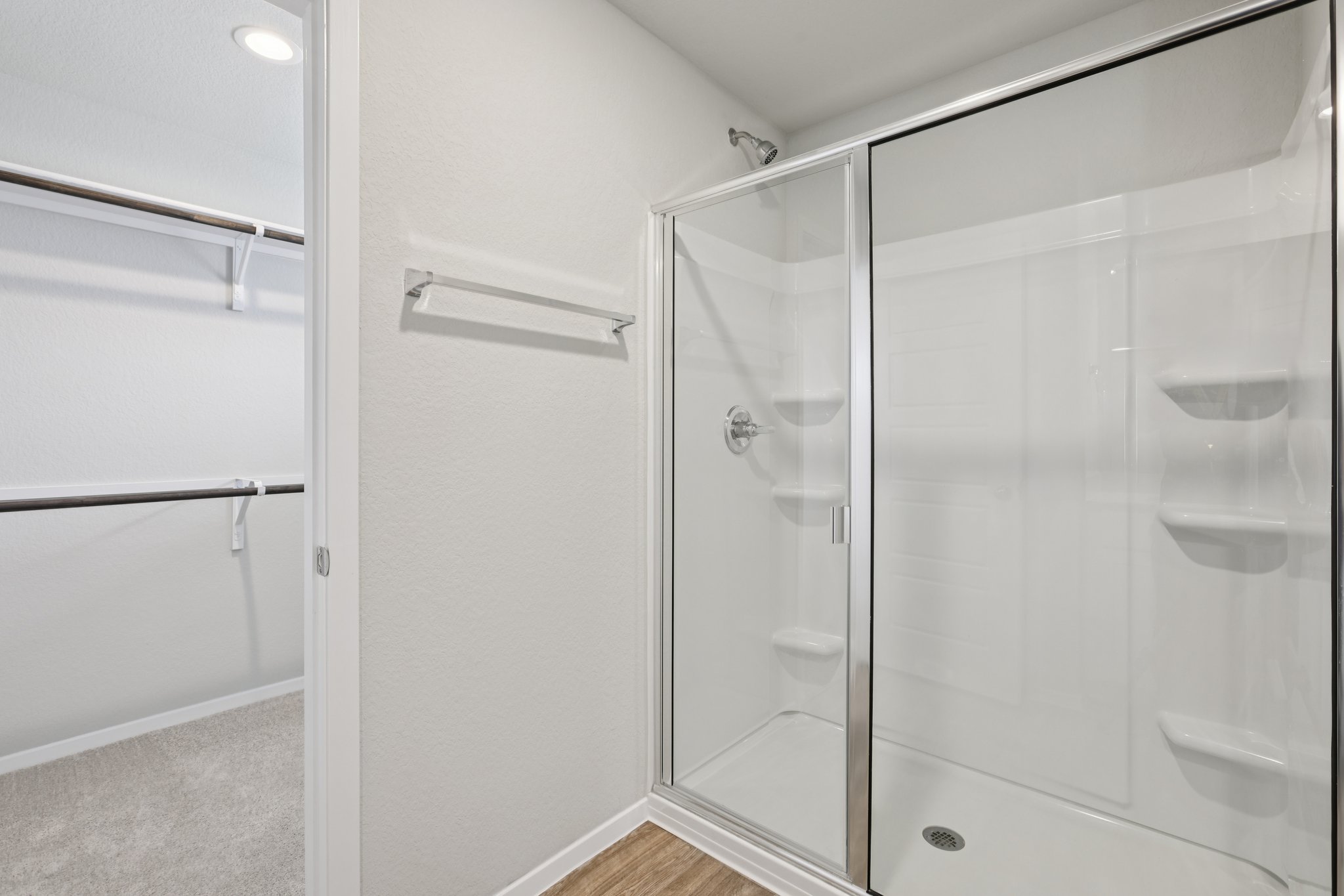297 Jade Street Maxwell, TX 78656 - Photo 21 of 40 a bathroom with a glass shower door