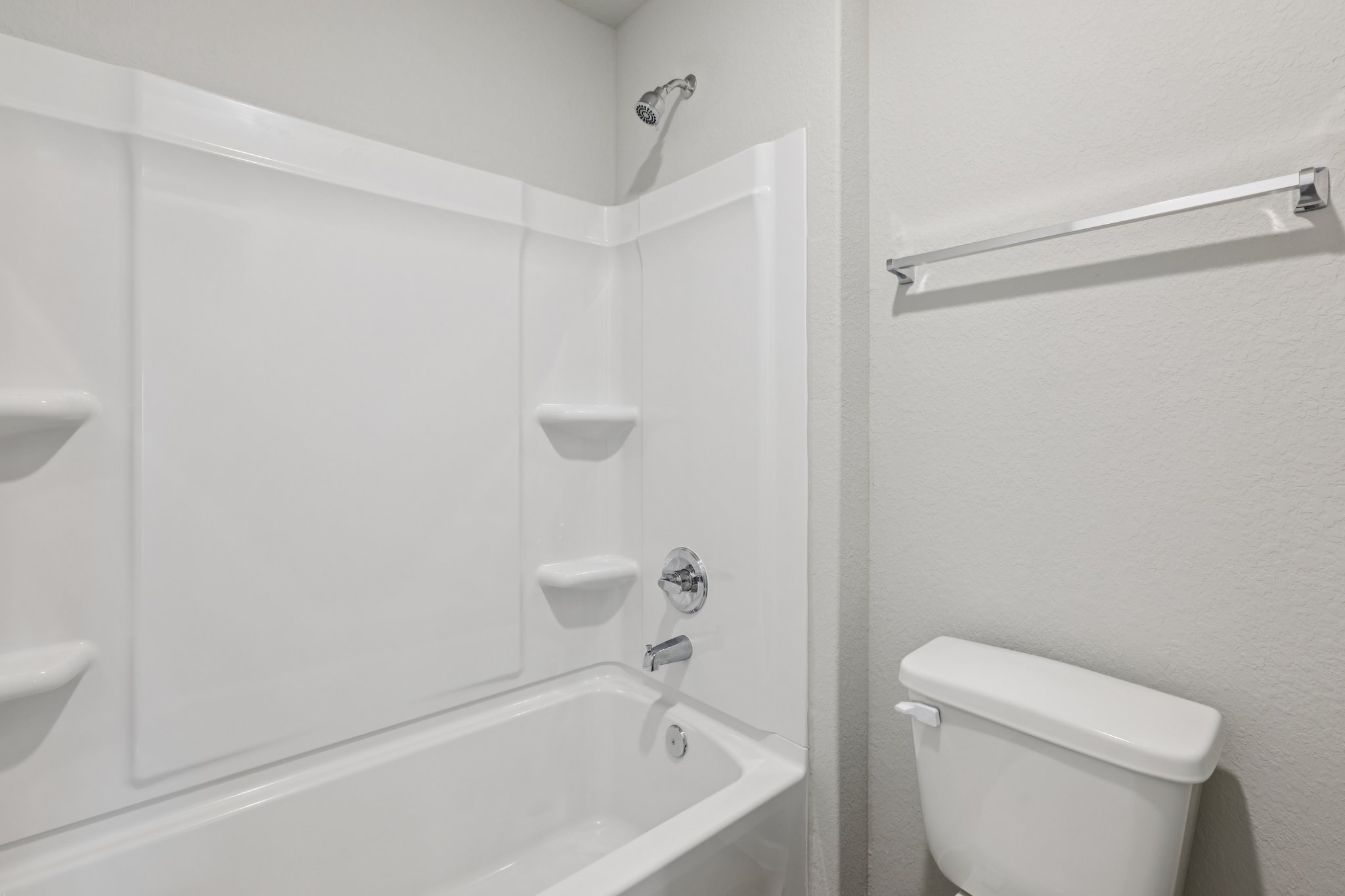 297 Jade Street Maxwell, TX 78656 - Photo 32 of 40 a bathroom with a toilet and a bathtub