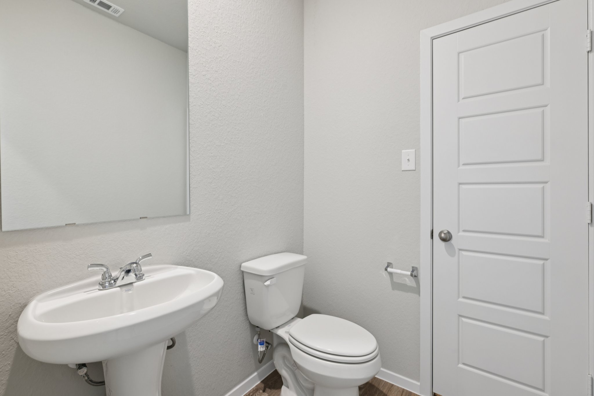 297 Jade Street Maxwell, TX 78656 - Photo 33 of 40 a bathroom with a sink toilet and a mirror