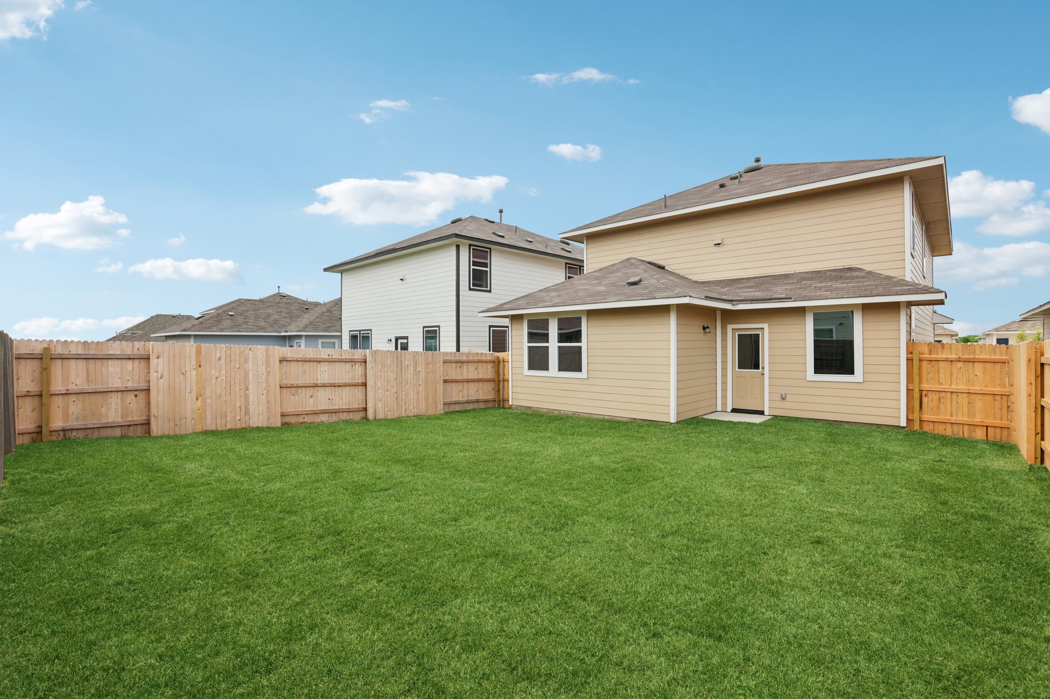 297 Jade Street Maxwell, TX 78656 - Photo 36 of 40 a view of a backyard with plants and a garden