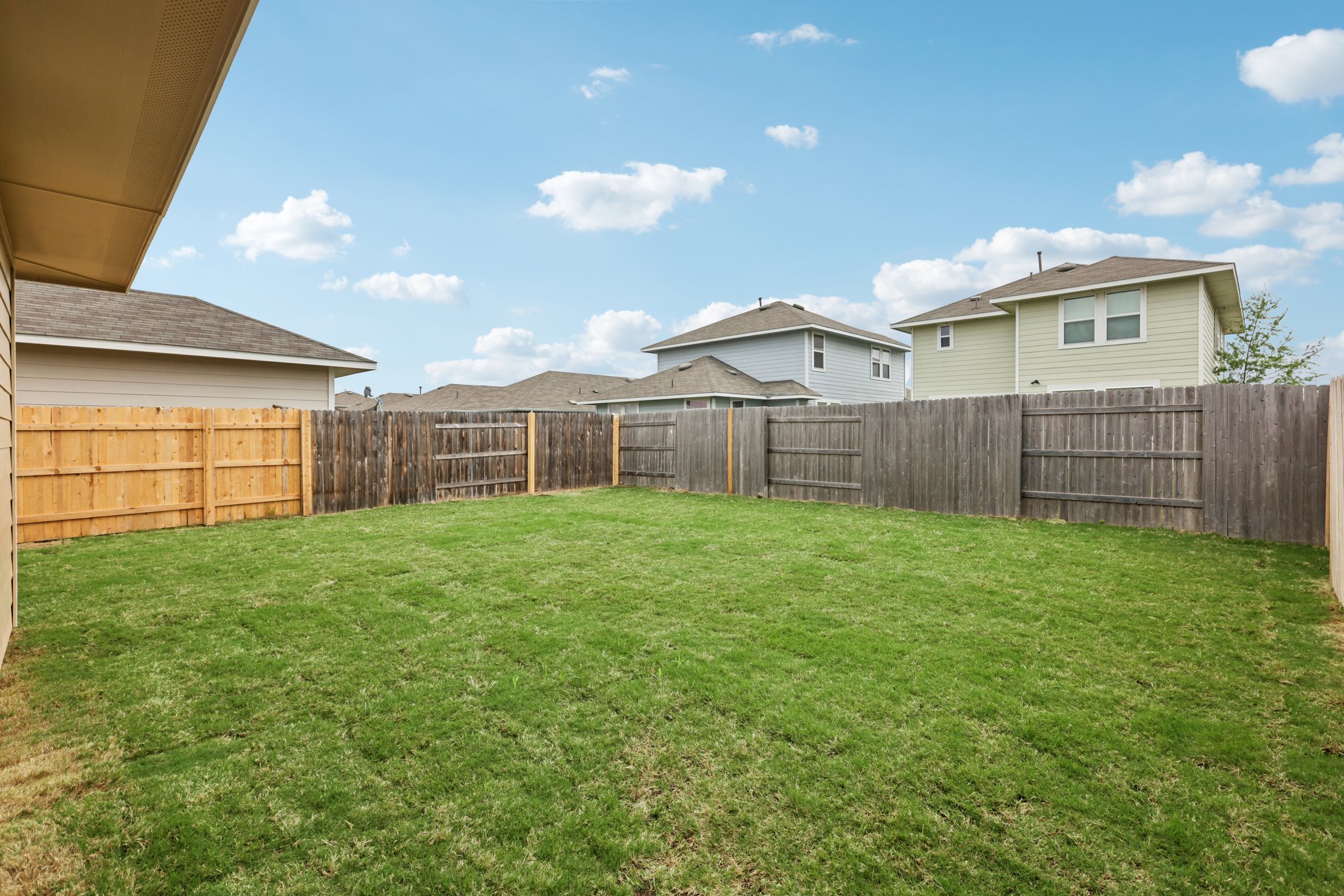 297 Jade Street Maxwell, TX 78656 - Photo 39 of 40 a view of a backyard with a garden and entertaining space