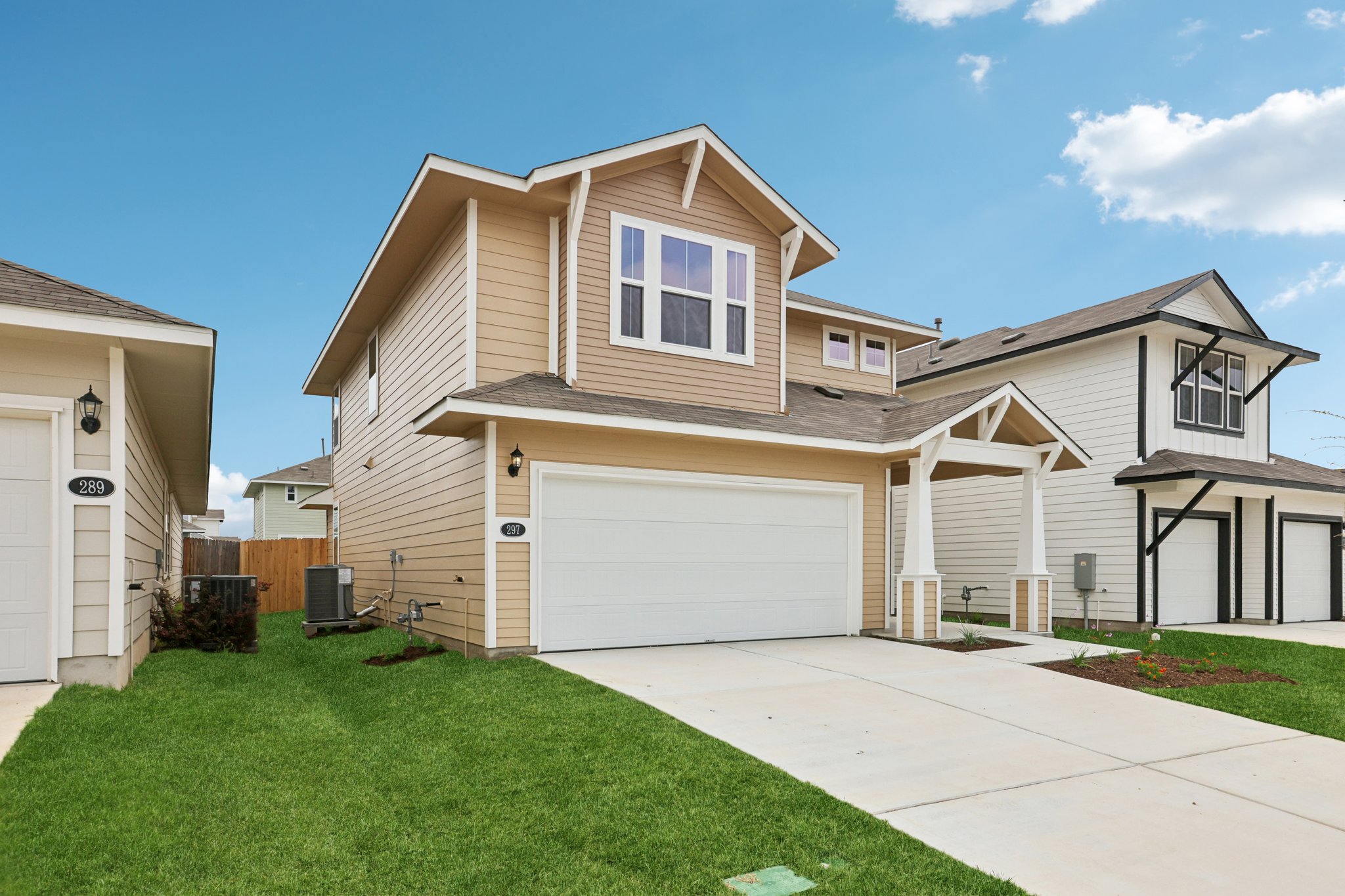 297 Jade Street Maxwell, TX 78656 - Photo 4 of 40 a front view of a house with a yard and garage