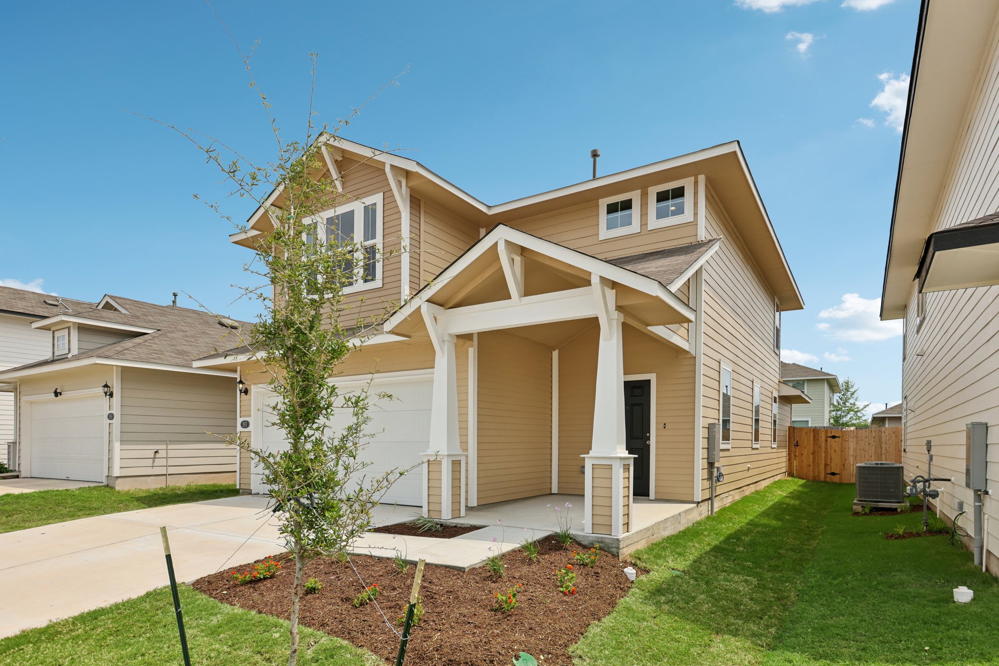 297 Jade Street Maxwell, TX 78656 - Photo 5 of 40 a front view of a house with a yard and garage