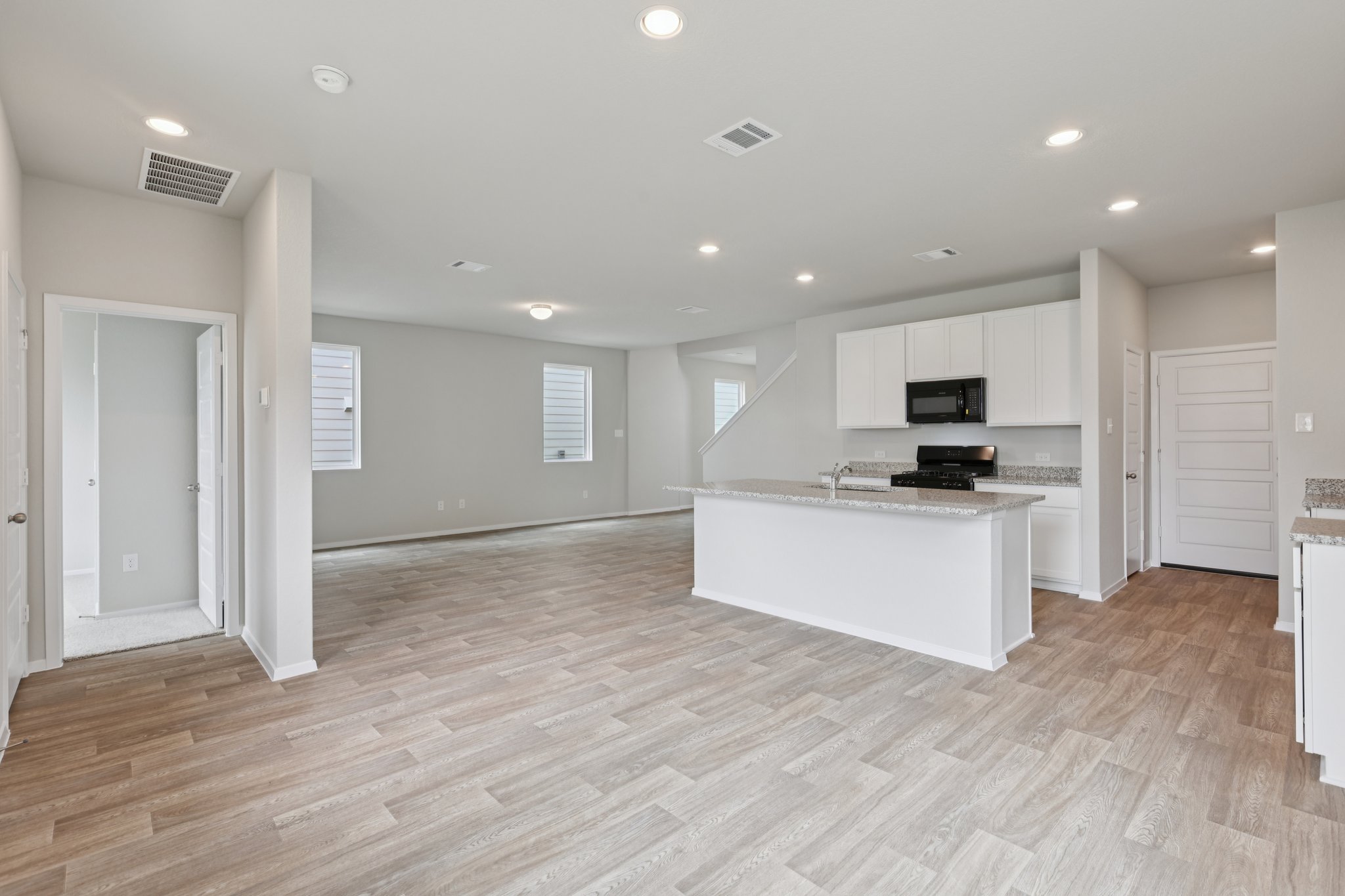 297 Jade Street Maxwell, TX 78656 - Photo 9 of 40 a view of kitchen with refrigerator sink and wooden floor