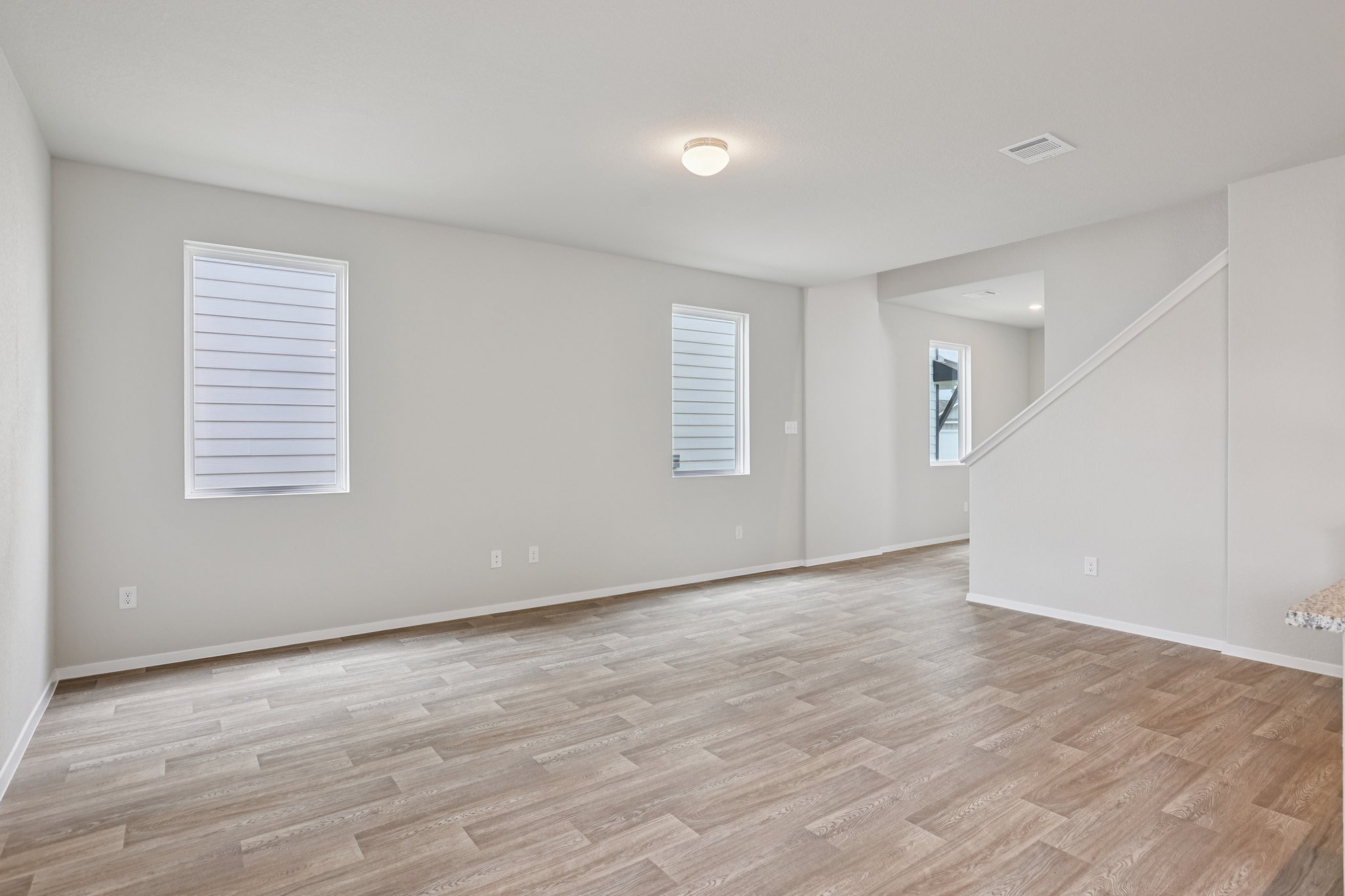 297 Jade Street Maxwell, TX 78656 - Photo 10 of 40 a view of an empty room with wooden floor and a window