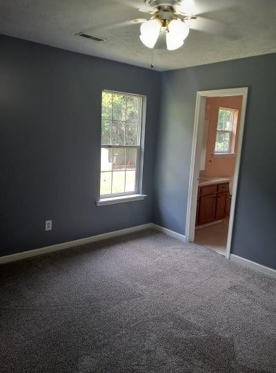 2041 Abingdon Drive La Vergne, TN 37086 - Photo 11 of 18 an empty room with chandelier fan and windows