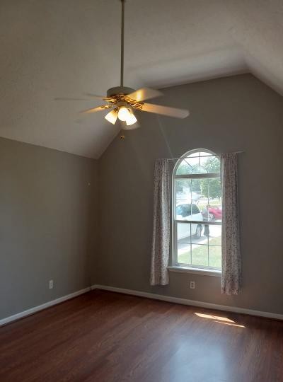 2041 Abingdon Drive La Vergne, TN 37086 - Photo 14 of 18 an empty room with wooden floor and windows