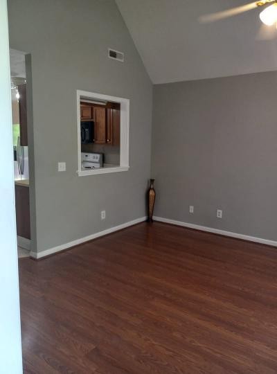 2041 Abingdon Drive La Vergne, TN 37086 - Photo 4 of 18 a view of an empty room with wooden floor and a window