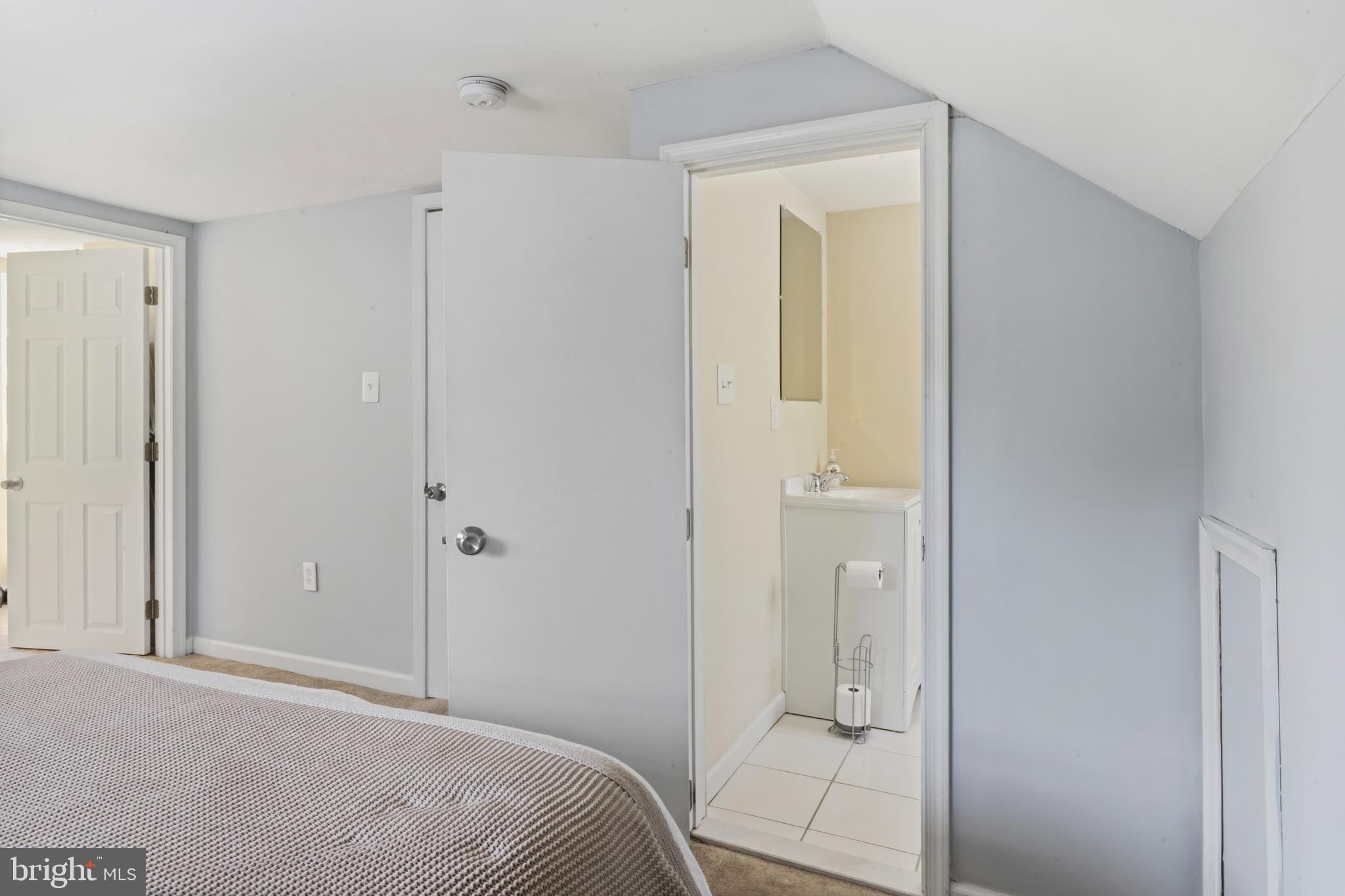 3700 Old Milford Mill Road Windsor Mill, MD 21244 - Photo 25 of 49 a bedroom with a bed and a bathroom