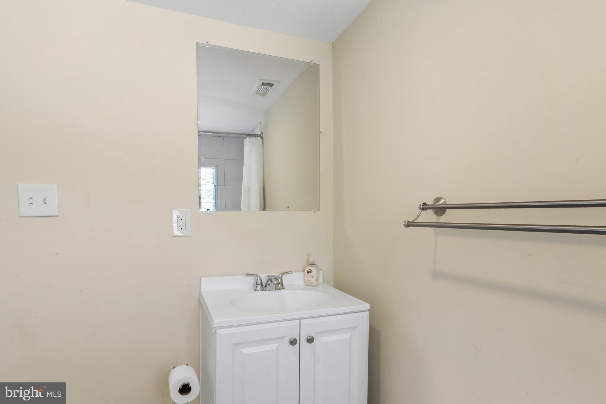 3700 Old Milford Mill Road Windsor Mill, MD 21244 - Photo 27 of 49 a bathroom with a sink and mirror