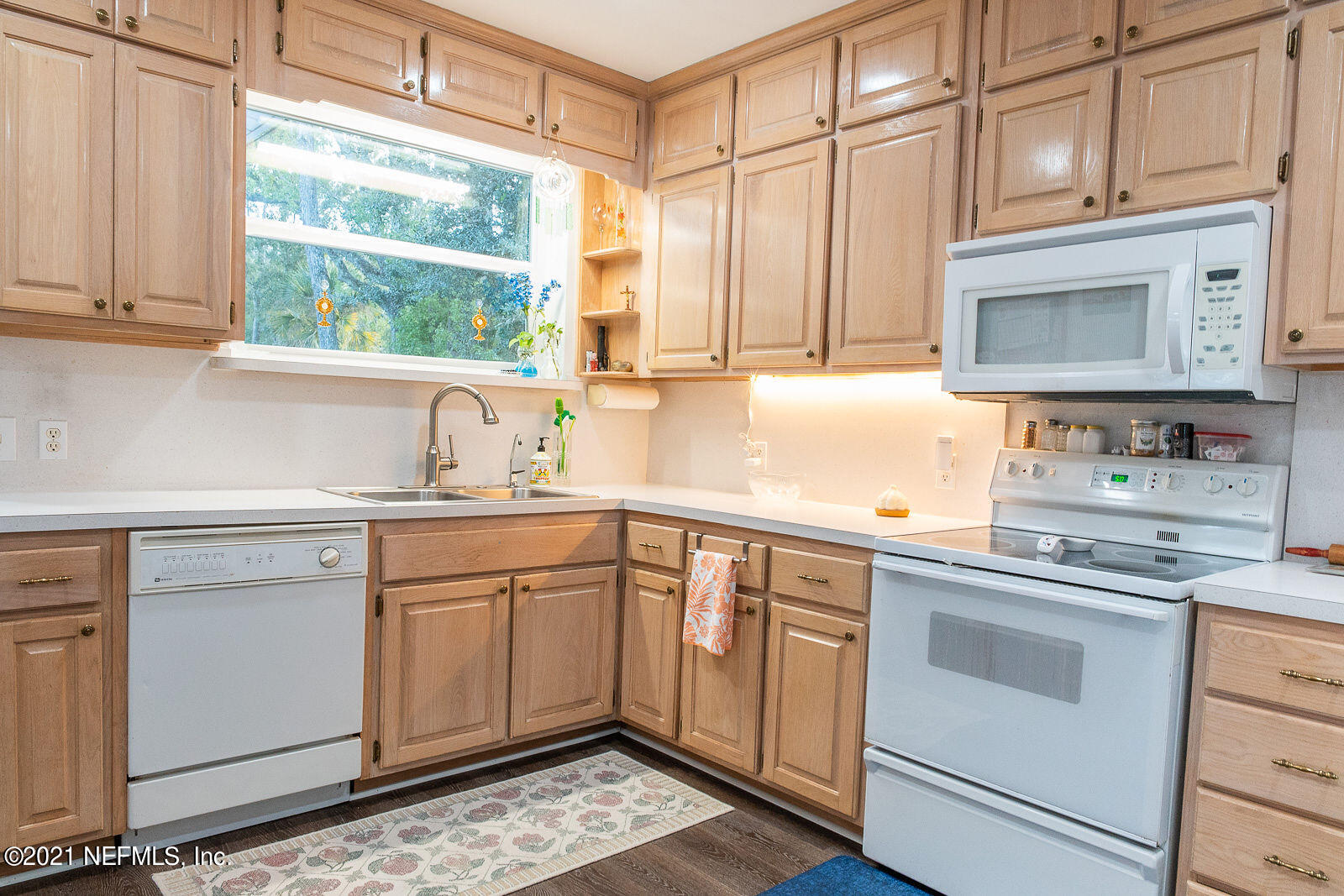 754 Old Hickory Road Jacksonville, FL 32207 - Photo 11 of 21 a kitchen with white cabinets and white appliances