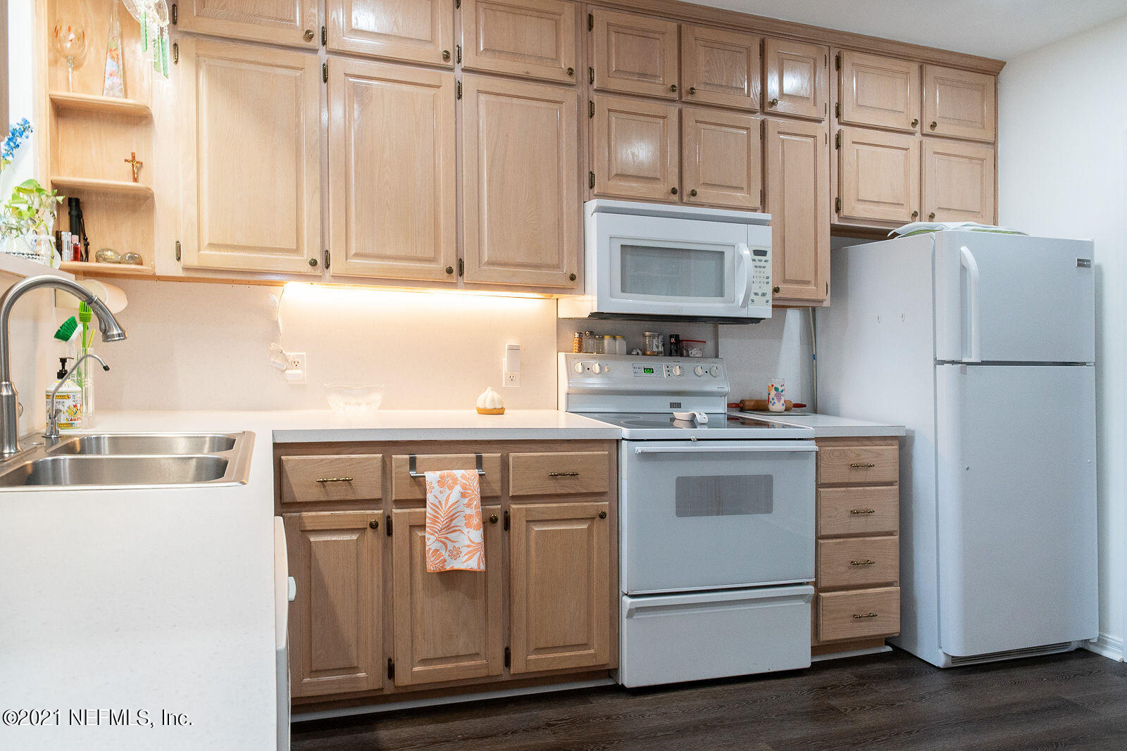 754 Old Hickory Road Jacksonville, FL 32207 - Photo 12 of 21 a kitchen with stainless steel appliances granite countertop a refrigerator stove a sink and dishwasher with wooden floor