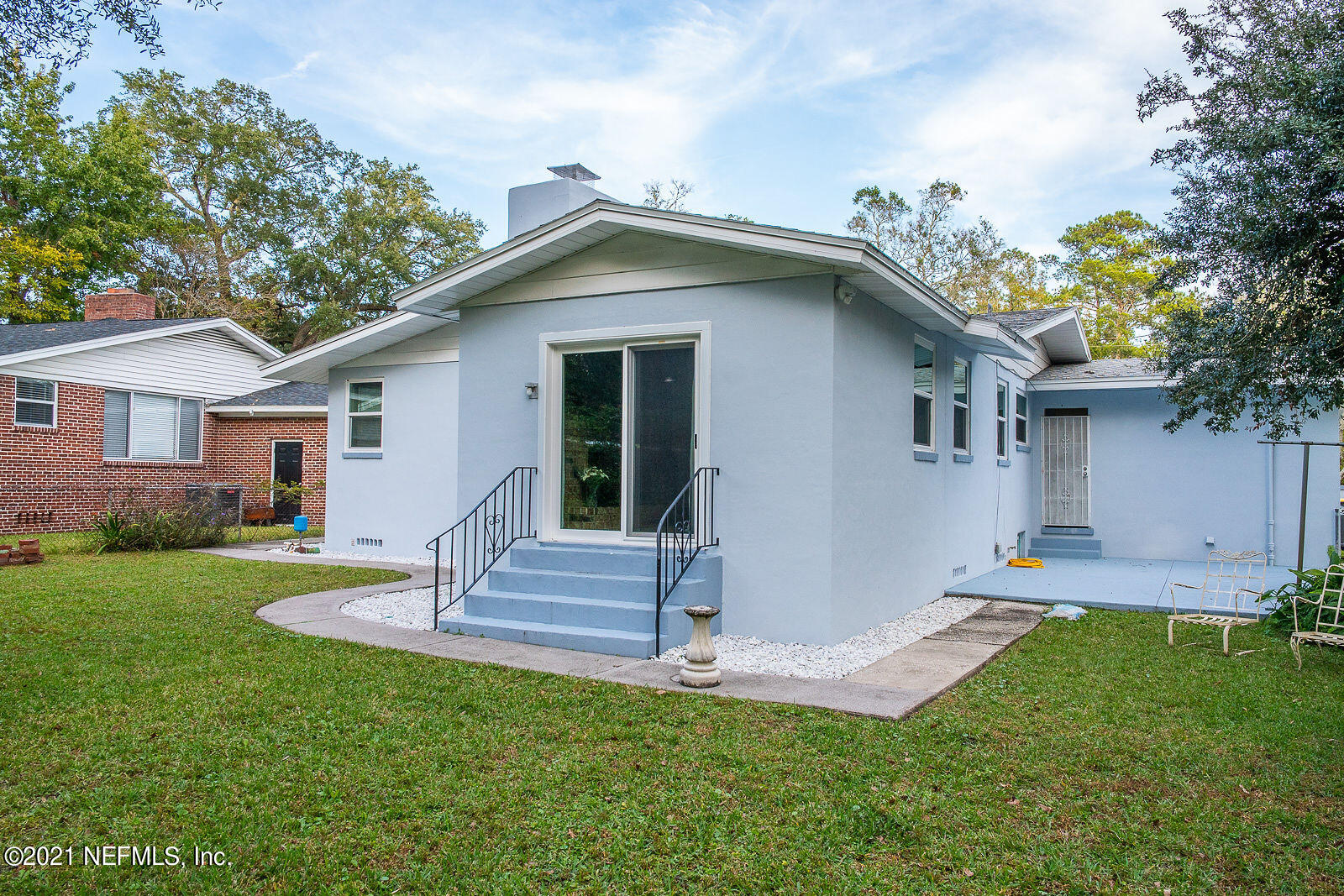 754 Old Hickory Road Jacksonville, FL 32207 - Photo 19 of 21 a front view of house with a garden and patio