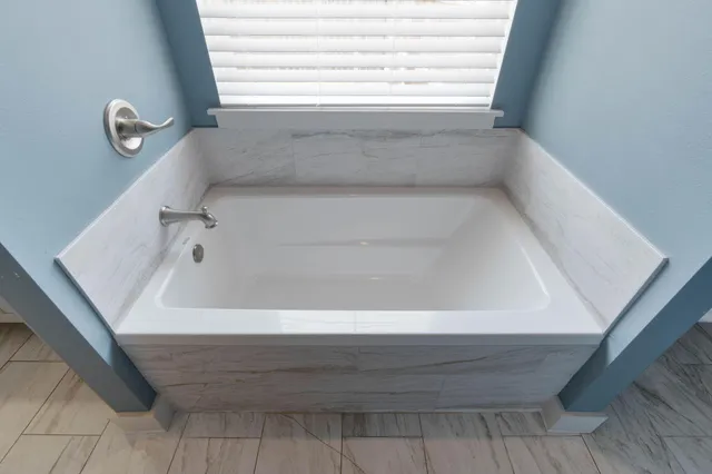 a bathroom with a bathtub