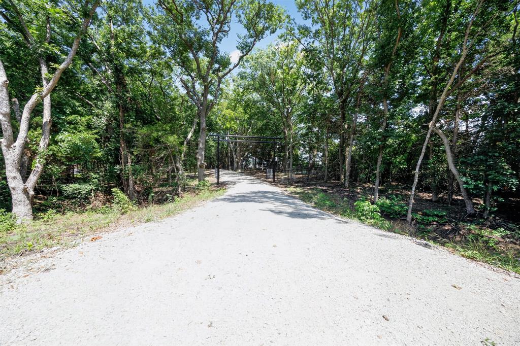 0 Willy Vester Road Van Alstyne, TX 75495 - Photo 13 of 19 a wooden bench with trees in the background