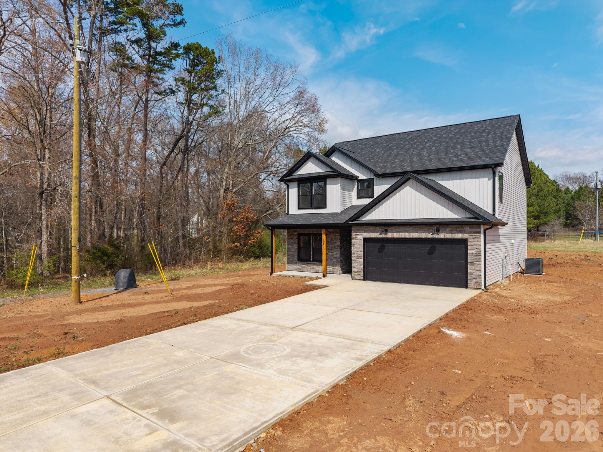 1050 Gibson Road Salisbury, NC 28147 - Photo 44 of 47 a front view of a house with a yard