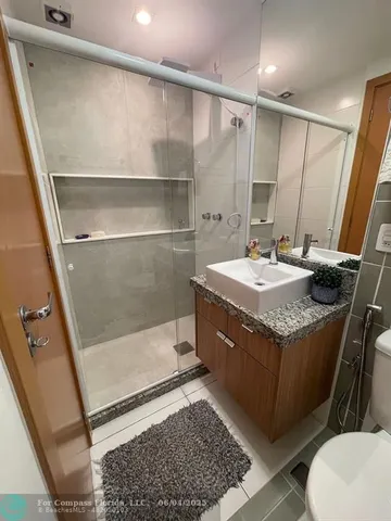 a bedroom with a bed and a mirror