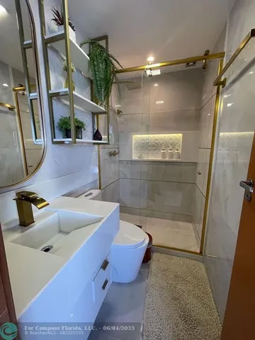 a bathroom with a tub and a shower