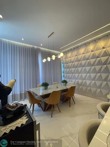 a living room with furniture and a lamp