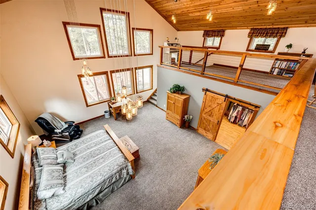 a view of a livingroom with furniture and a staircase