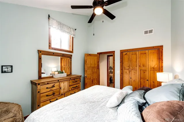 a bedroom with a bed and a dresser