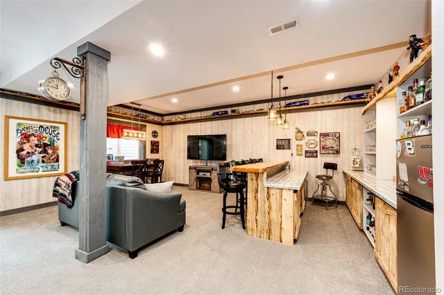 a kitchen with stainless steel appliances granite countertop a stove and a refrigerator