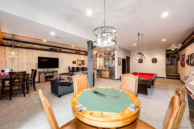 a room with furniture and pool table