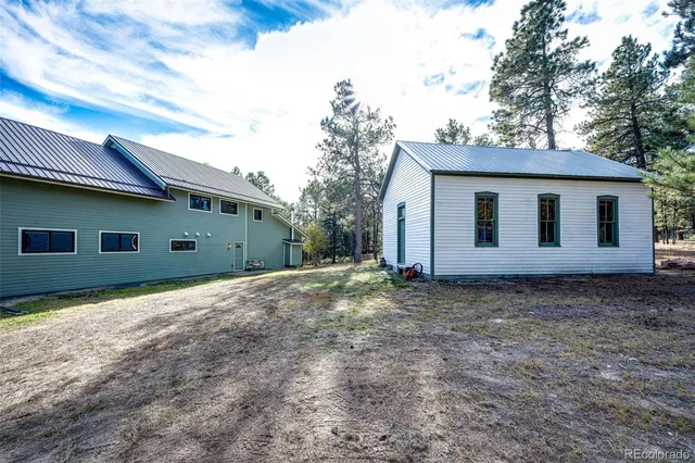 a living room with lots of furniture and gym equipment