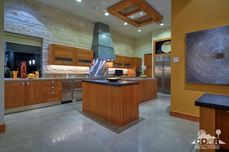 10 Rockcrest Rancho Mirage, CA 92270 - Photo 17 of 32 a kitchen with kitchen island a sink a stove and a refrigerator