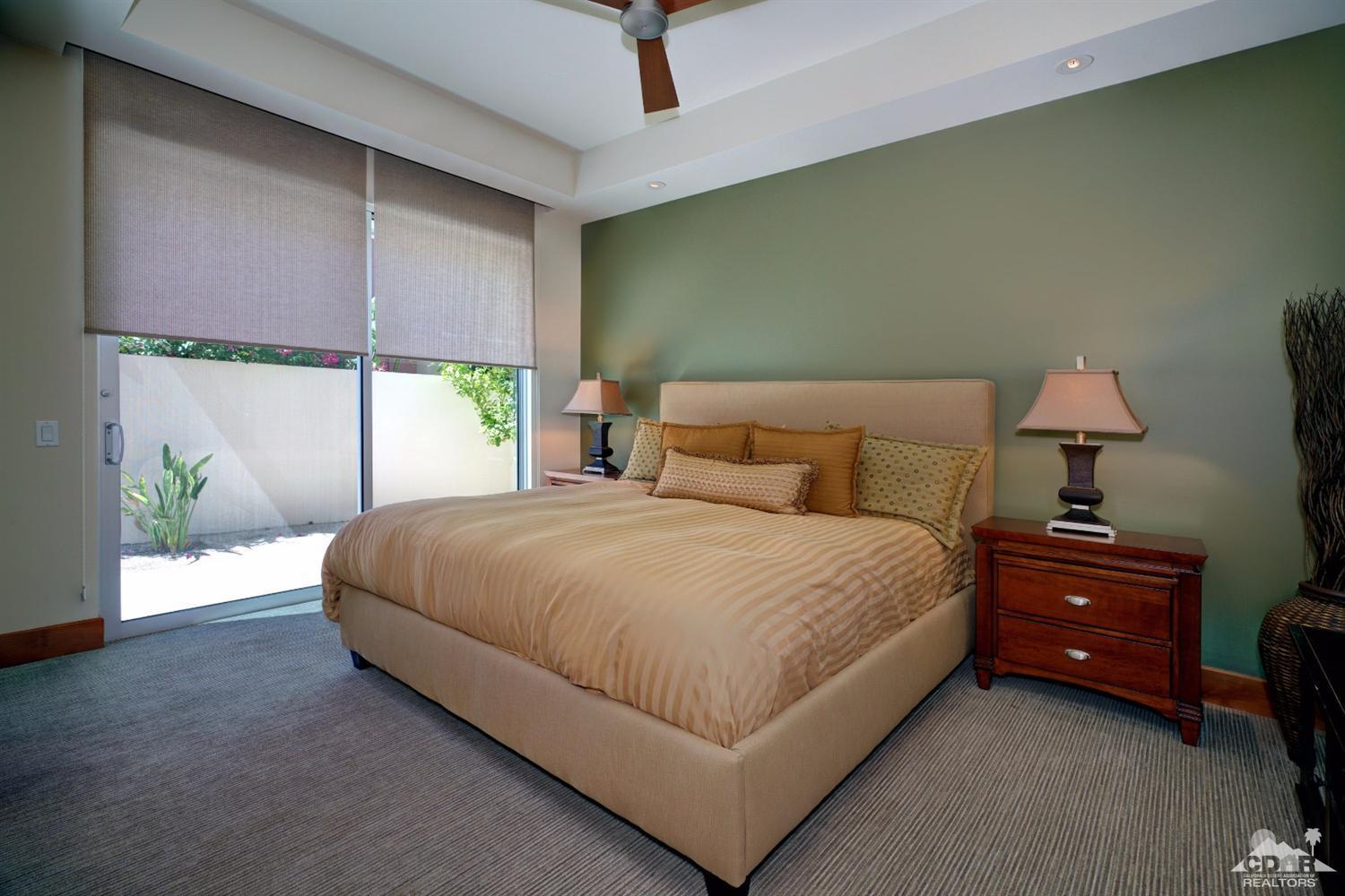 10 Rockcrest Rancho Mirage, CA 92270 - Photo 30 of 32 a bedroom with a bed and window