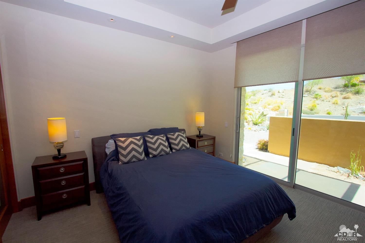 10 Rockcrest Rancho Mirage, CA 92270 - Photo 32 of 32 a bedroom with a bed and a large window