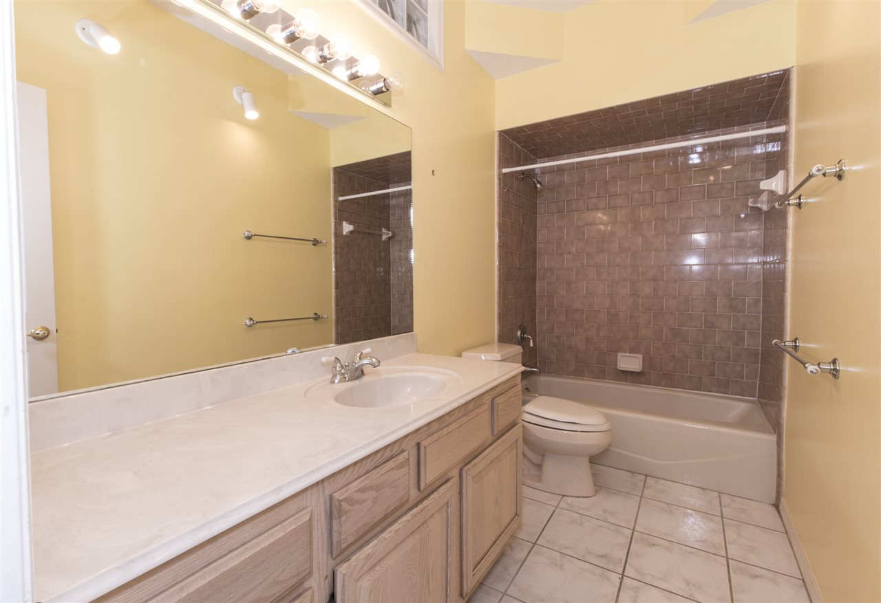 4200 Wicks Branch Road St. Augustine, FL 32086 - Photo 19 of 25 a bathroom with a sink a toilet and shower
