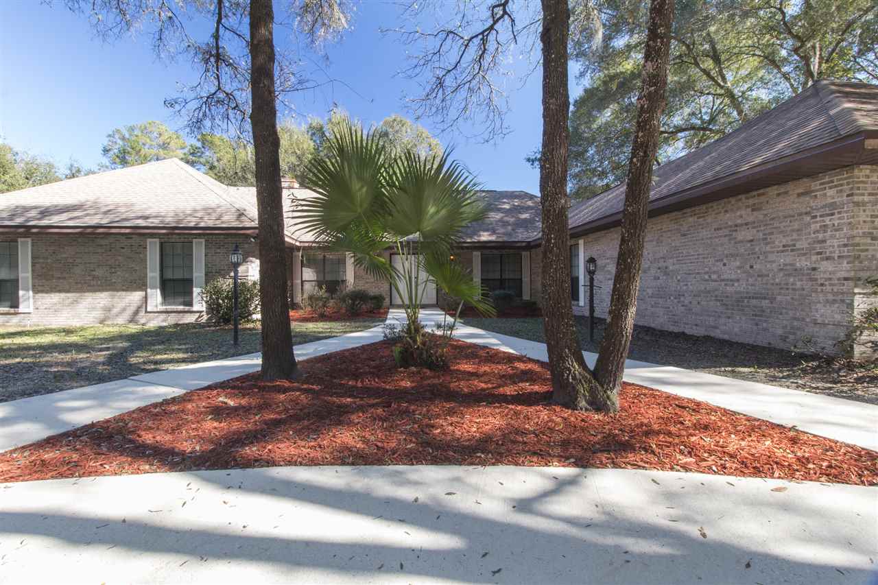 4200 Wicks Branch Road St. Augustine, FL 32086 - Photo 3 of 25 a view of a house with a tree in front of it