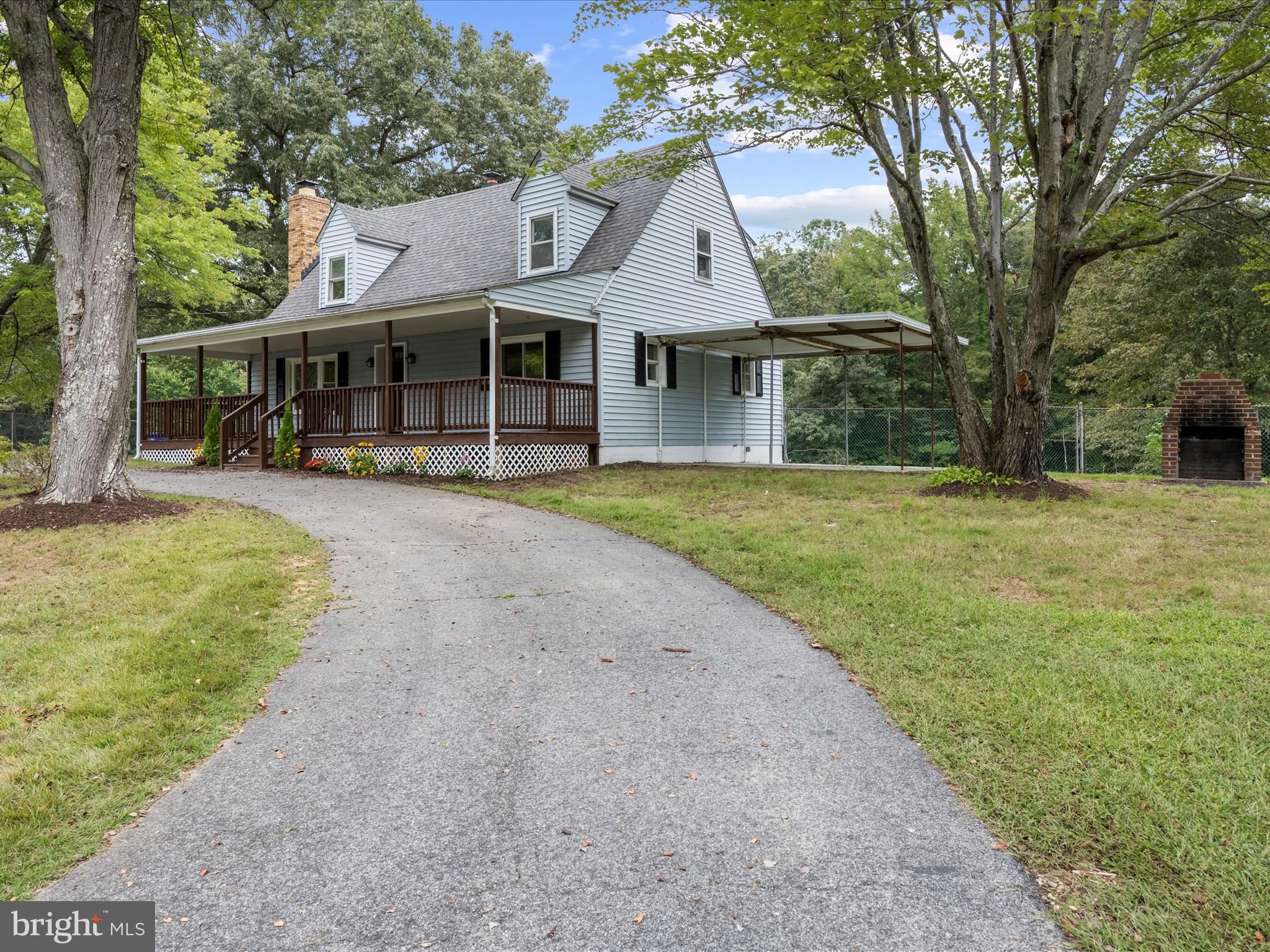 5660 New Cut Road Marbury, MD 20658 - Photo 3 of 38 a front view of a house with a garden