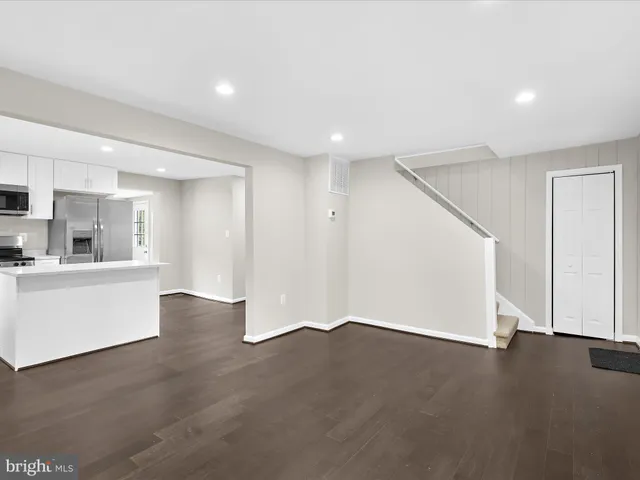 a view of a kitchen with a sink and a large window
