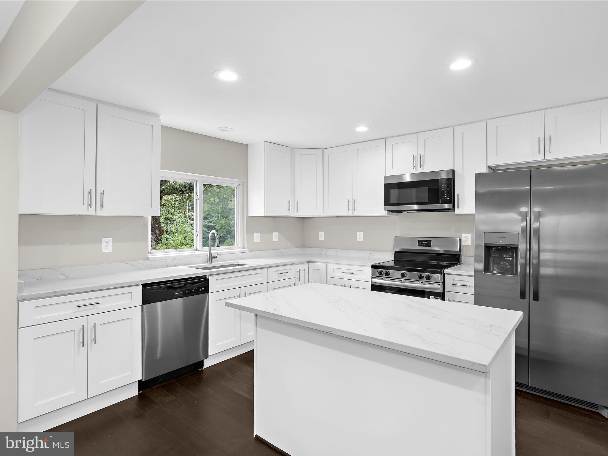 5660 New Cut Road Marbury, MD 20658 - Photo 9 of 38 a kitchen with a sink a microwave a stove and refrigerator