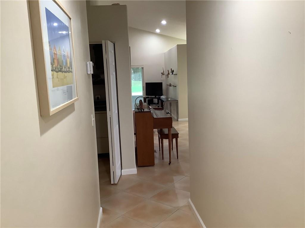 7904 Mansfield Hollow Road Delray Beach, FL 33446 - Photo 14 of 27 a view of kitchen with furniture and a refrigerator