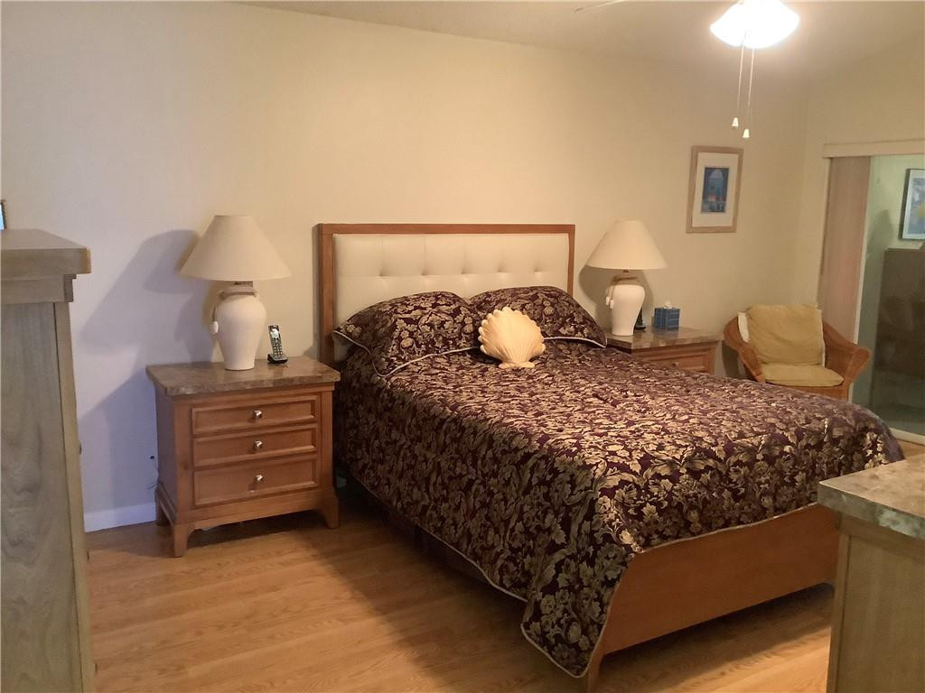 7904 Mansfield Hollow Road Delray Beach, FL 33446 - Photo 17 of 27 a bedroom with a bed and a dresser