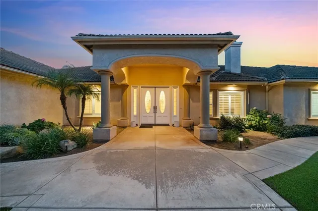 a front view of a house with yard