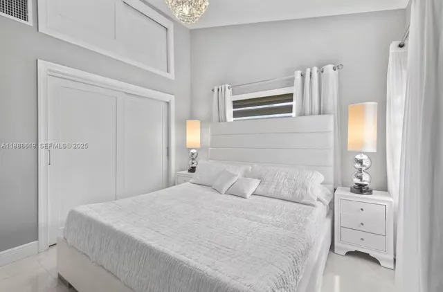 a bathroom with a double vanity sink toilet and shower