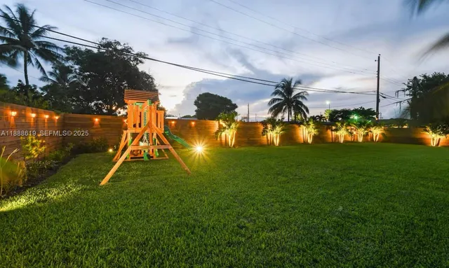 a view of a house with a backyard porch and sitting area