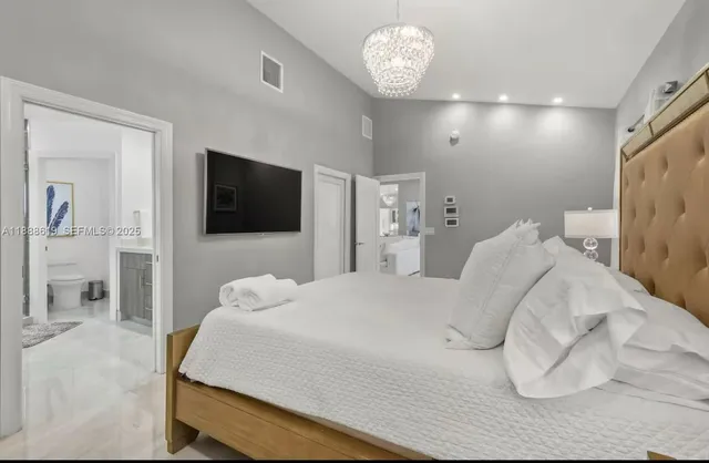 a bathroom with a double vanity sink mirror and toilet