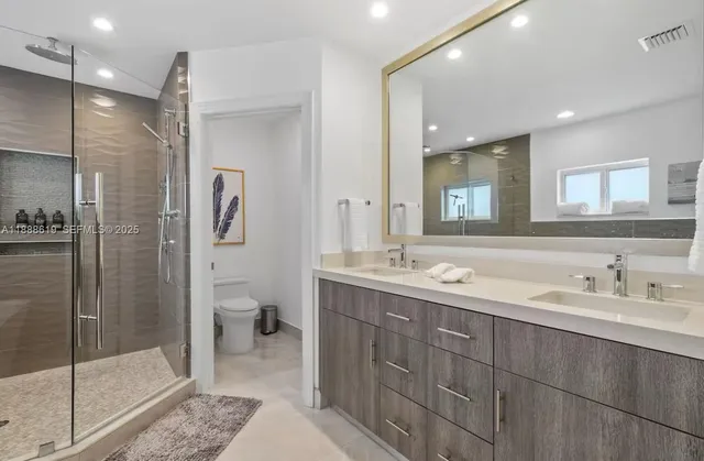 a bathroom with a bathtub and a shower