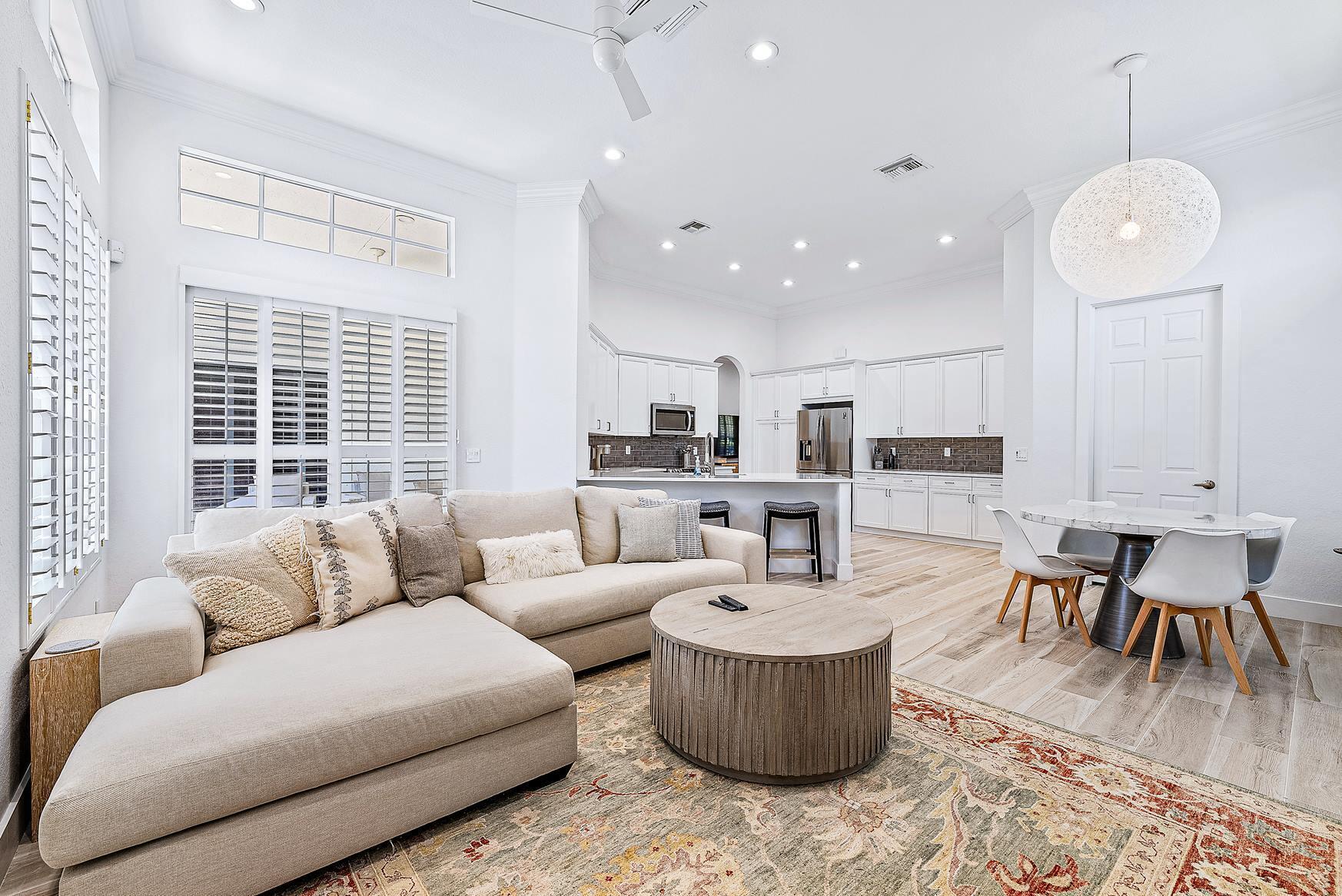 102 Via Santa Cruz Jupiter, FL 33458 - Photo 13 of 30 a living room with furniture and a large window