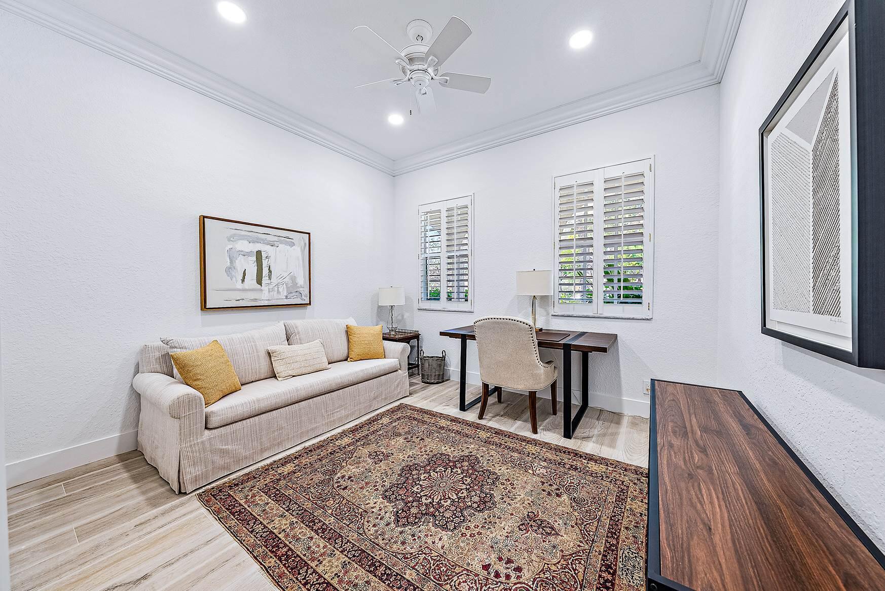 102 Via Santa Cruz Jupiter, FL 33458 - Photo 15 of 30 a living room with furniture two window and a wooden floor