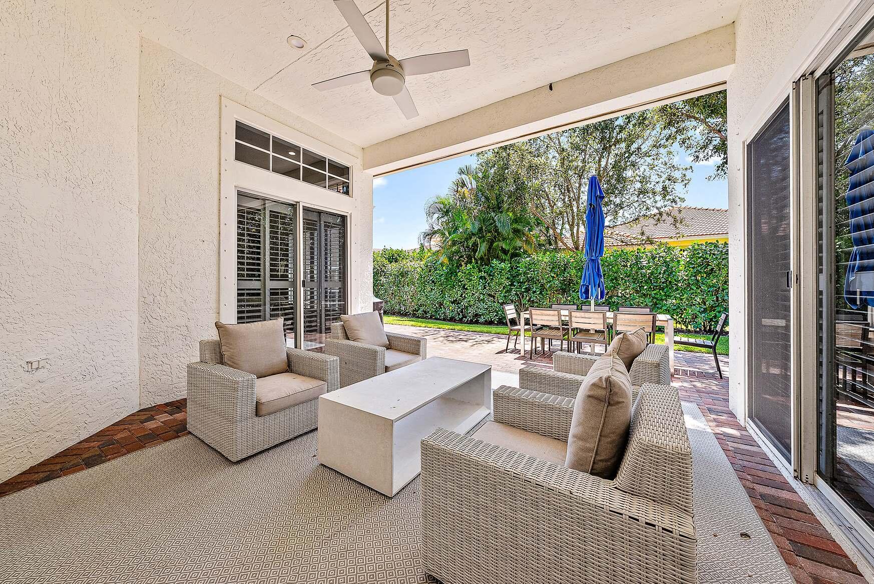 102 Via Santa Cruz Jupiter, FL 33458 - Photo 21 of 30 a living room with furniture and a large window