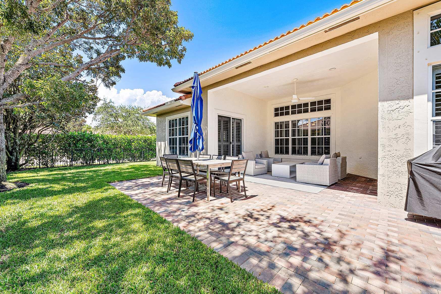 102 Via Santa Cruz Jupiter, FL 33458 - Photo 22 of 30 a view of a house with backyard and sitting area