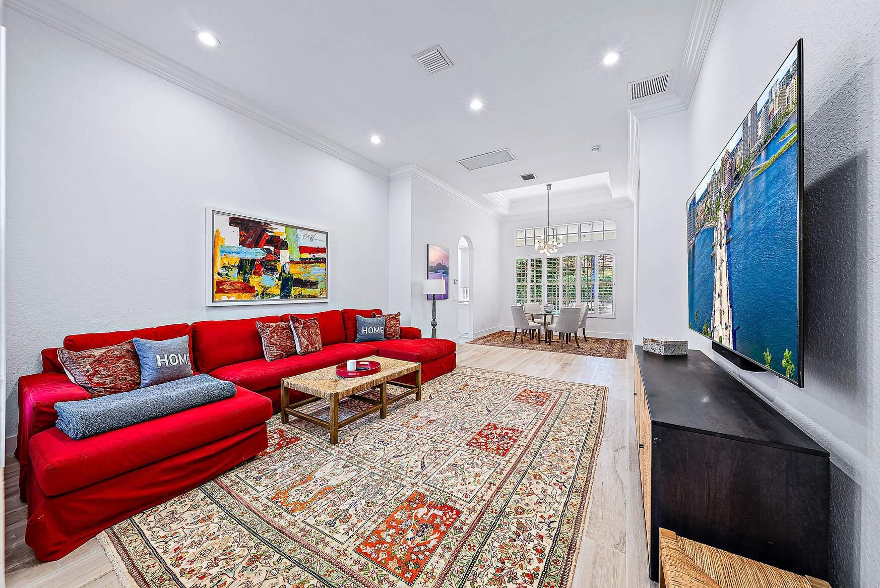 102 Via Santa Cruz Jupiter, FL 33458 - Photo 5 of 30 a living room with furniture and a flat screen tv