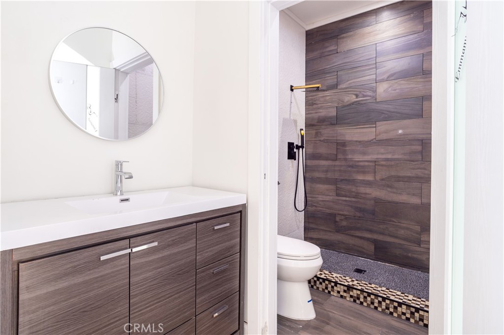 13331 Moorpark Street, Unit 319 Sherman Oaks, CA 91423 - Photo 16 of 46 a bathroom with a sink a toilet and shower