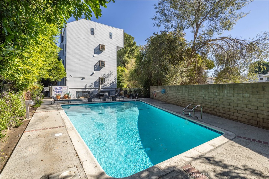 13331 Moorpark Street, Unit 319 Sherman Oaks, CA 91423 - Photo 25 of 46 a view of a swimming pool with a lake view
